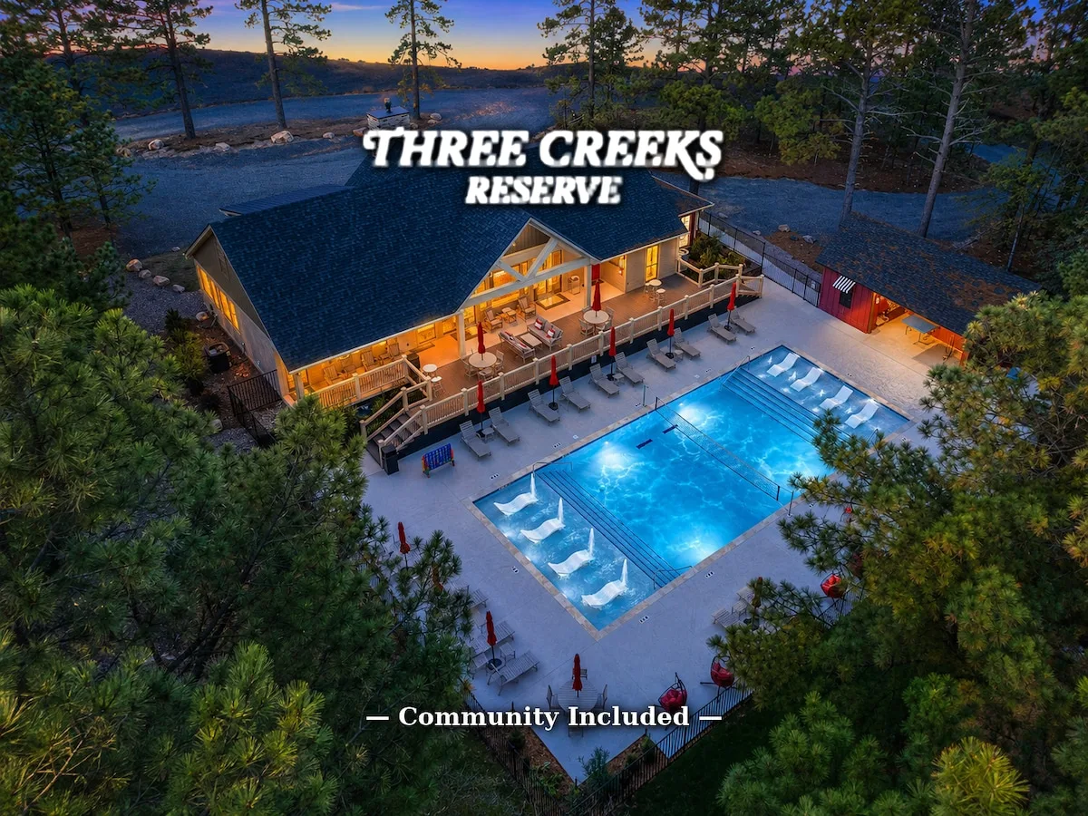 Three Creeks Reserve resort pool and clubhouse across the street from The Black-Beary luxury cabin in Broken Bow